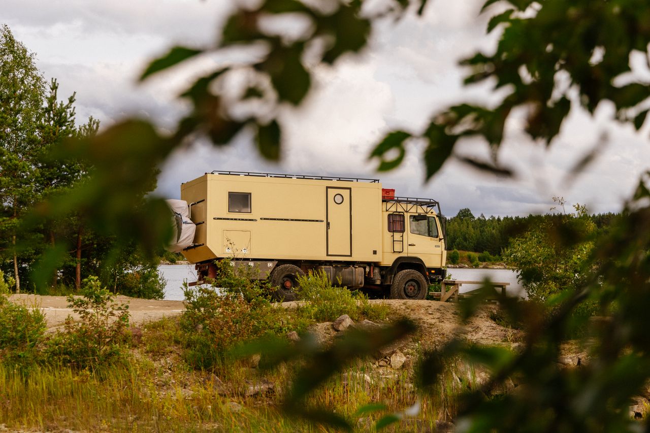 Crafting Captivating Headlines: Your awesome post title goes here Off-road camper truck parked in natural surroundings in Rummu, Estonia, offering adventure travel vibes.